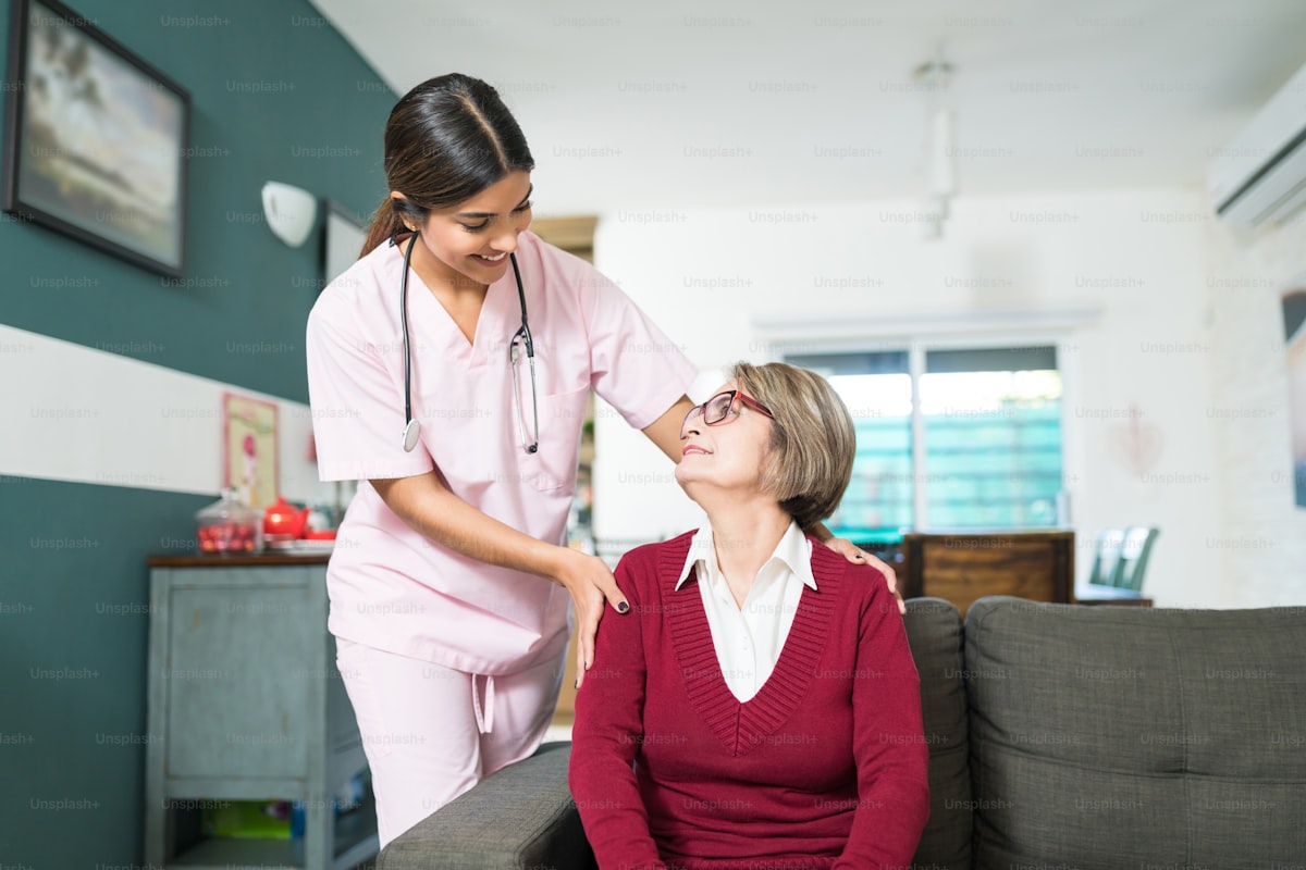 Nurse talking with smiling senior woman